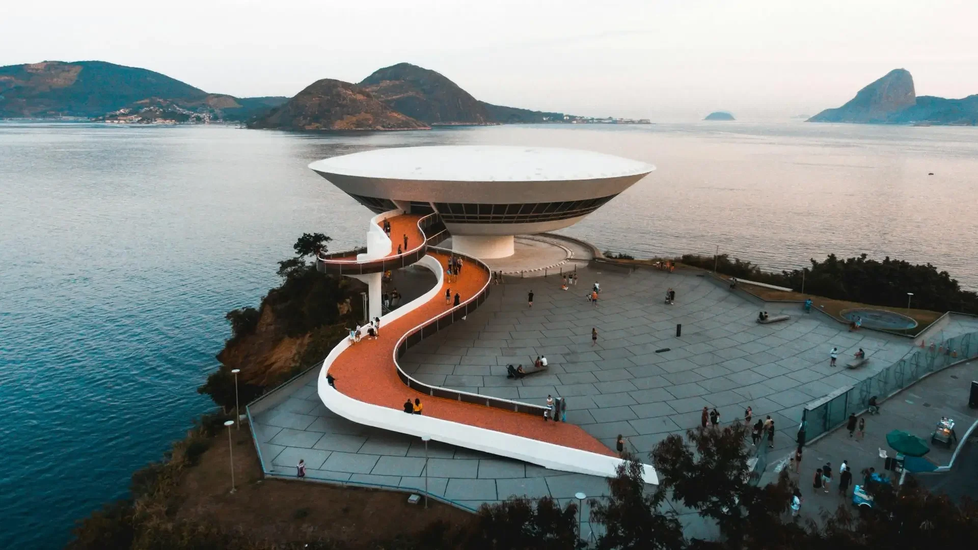 Niterói: Niemeyer's MAC Museum & Colonial Forts - Panoramic view of Rio de Janeiro featuring MAC Niterói by Oscar Niemeyer